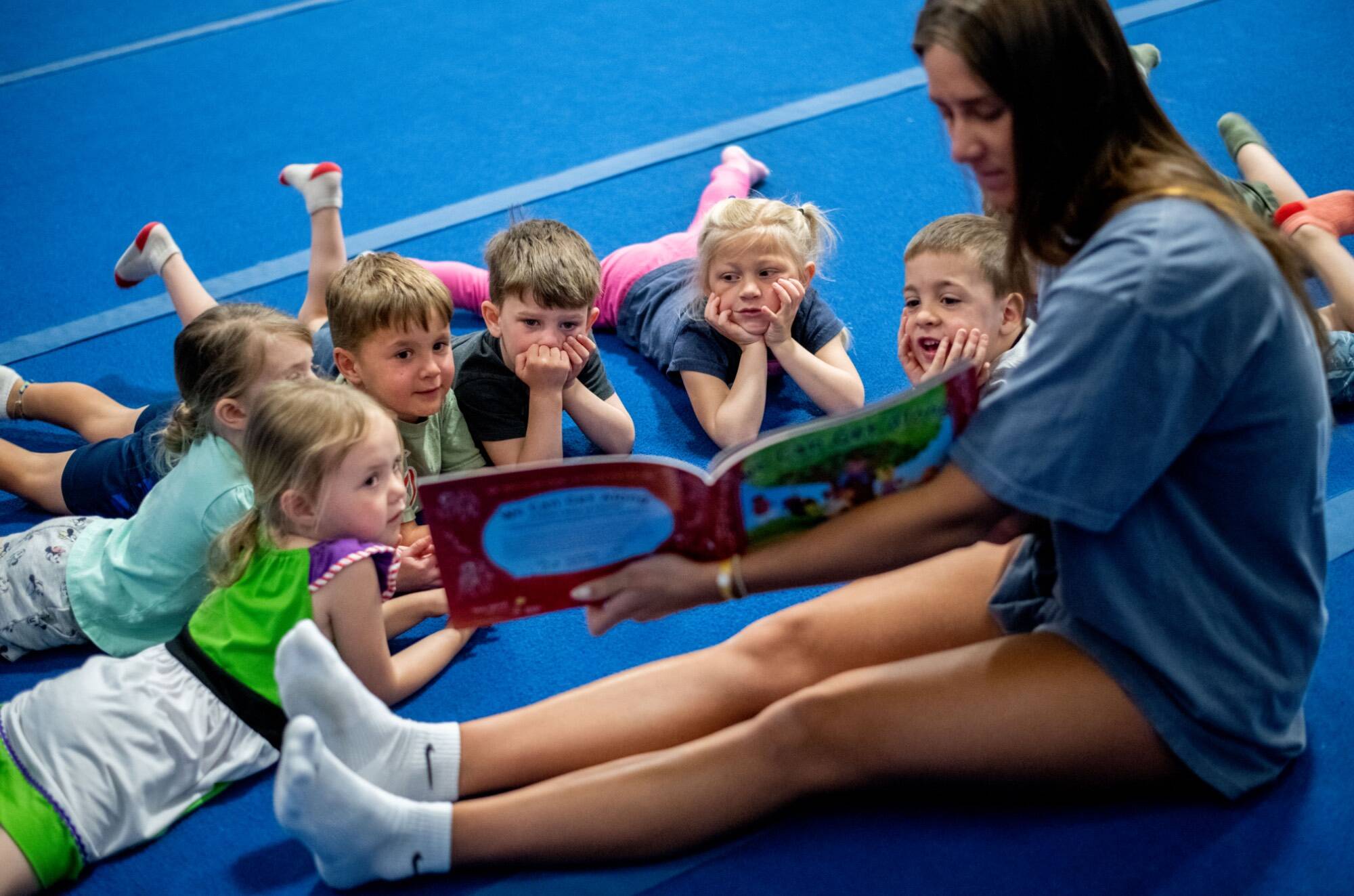 Woman reading to children.